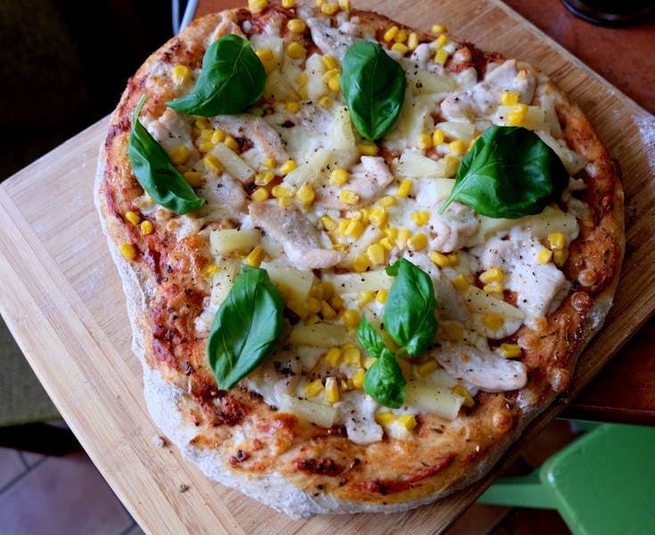 Chicken Pesto Pizza with basil pesto and grilled chicken