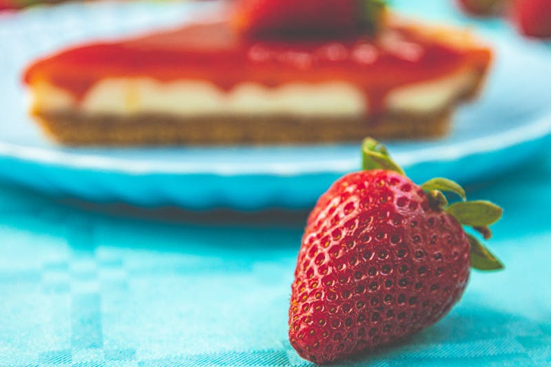 Fresh Fruit Cheesecake dessert with strawberry topping