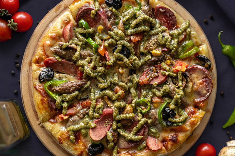 Margherita Specialty Pizza with fresh basil and tomatoes